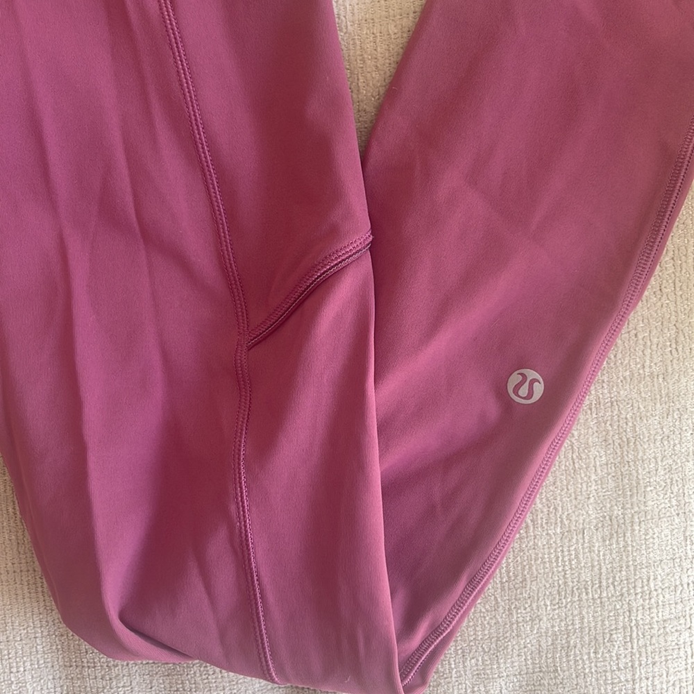 Pink Lululemon free high rise pant in size 4. Worn once!